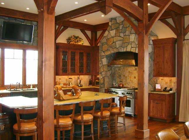 A Custom Christiana kitchen with a stone over the range and hood.