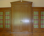 A cabinetry hutch to store a microwave in.