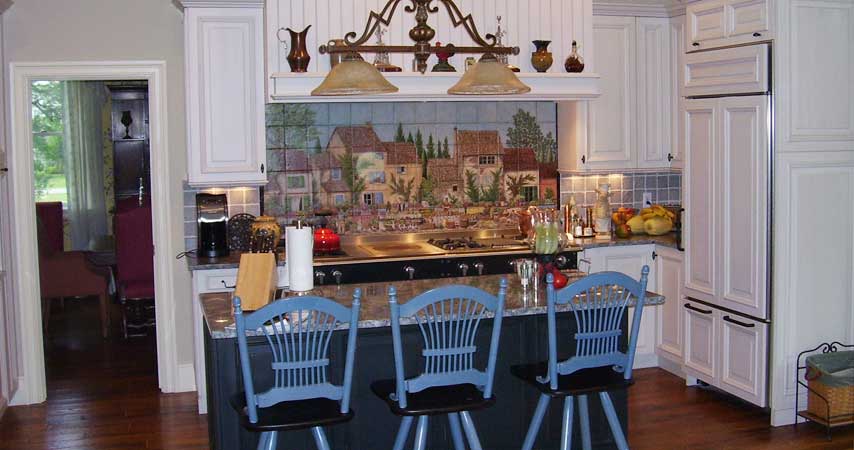 White wood-mode kitchen with island and granite tops.