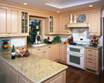 A custom maple kitchen with a raised decorative panel.
