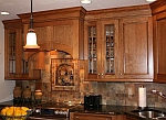 A cherry brookhaven kitchen with a black glaze.