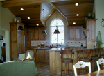 A rustic Cherry kitchen with a paneled subzero refrigerator.