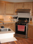 A light maple kitchen with shaker doors.